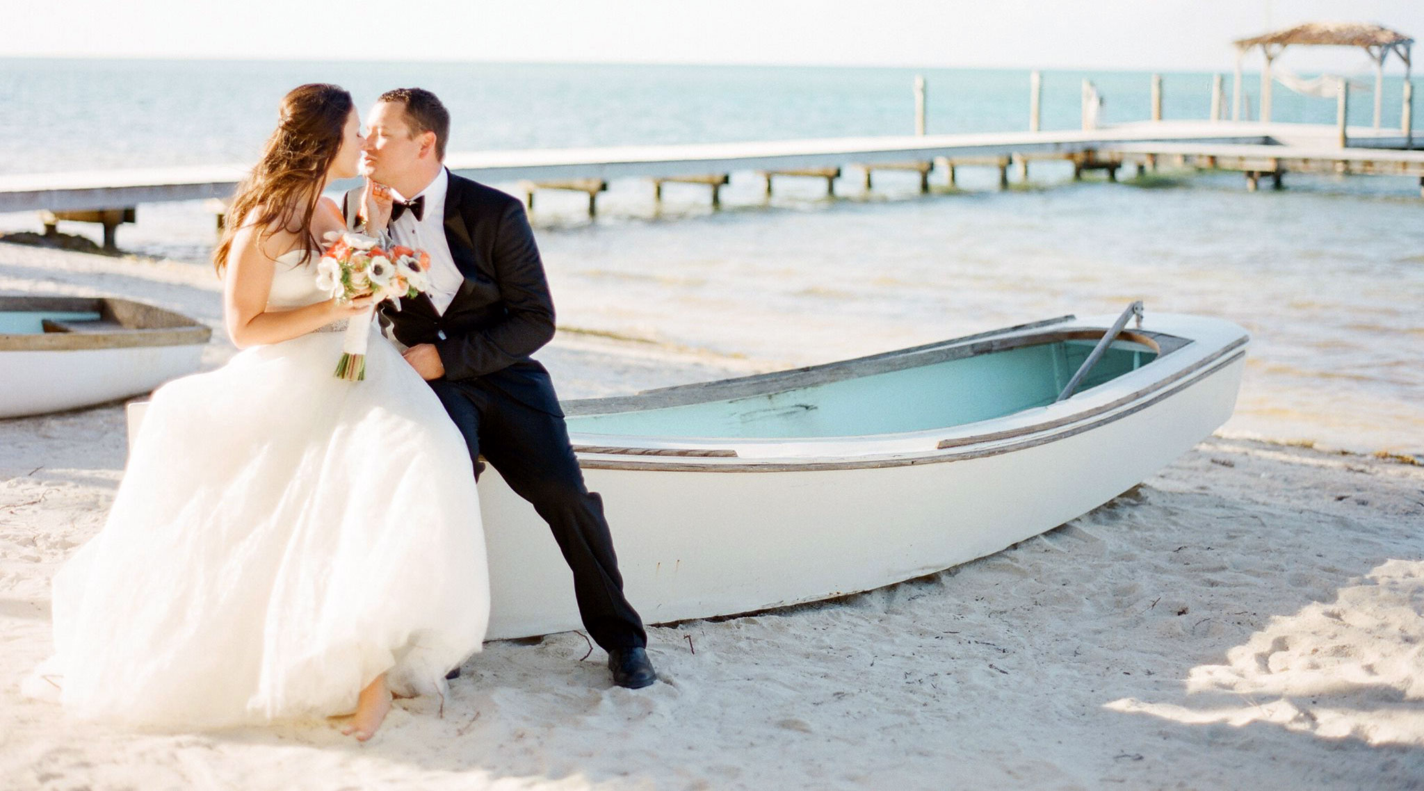 Couple with their preserved wedding dress