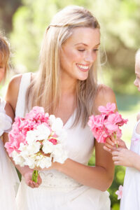 Bride WithFlower Girls Outdoors At Wedding